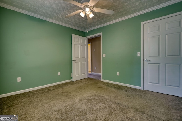 unfurnished bedroom with carpet floors, baseboards, and a ceiling fan
