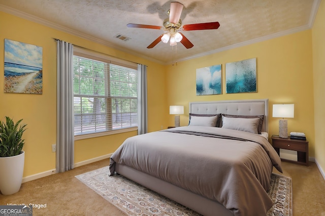 bedroom with carpet flooring, baseboards, ornamental molding, and a ceiling fan