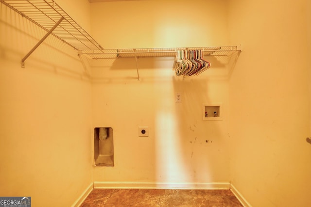 laundry room with hookup for an electric dryer, washer hookup, and baseboards