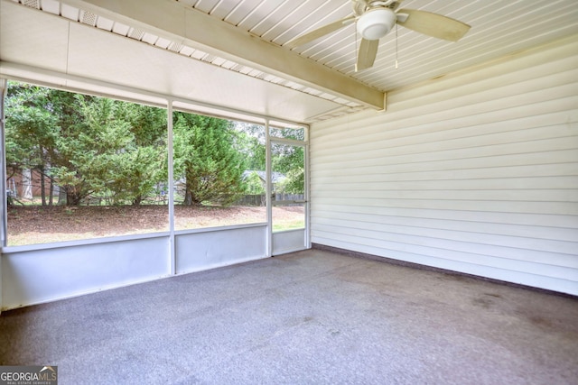 unfurnished sunroom featuring ceiling fan
