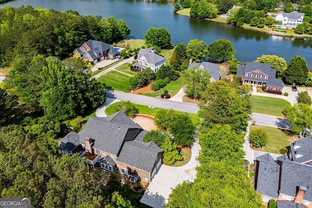 aerial view of residential area featuring a nearby body of water