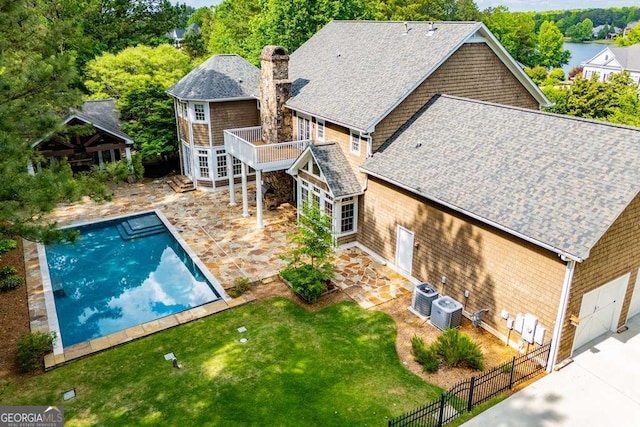 view of pool with central air condition unit, a patio area, and a deck