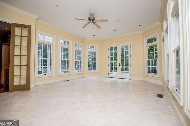 unfurnished sunroom featuring french doors and plenty of natural light