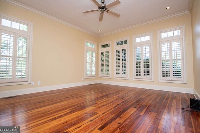 empty room featuring wood-type flooring, baseboards, a ceiling fan, ornamental molding, and recessed lighting