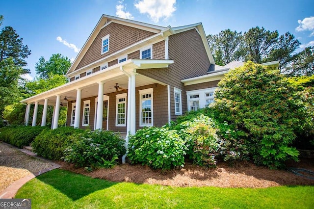 view of property exterior featuring ceiling fan