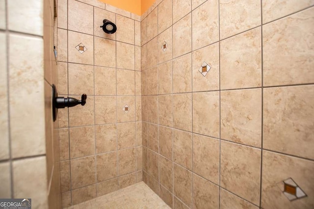 full bath featuring a tile shower