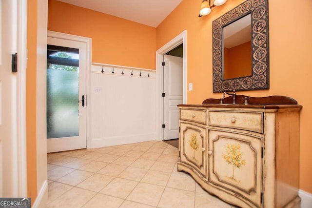 bathroom featuring tile patterned floors, vanity, and baseboards