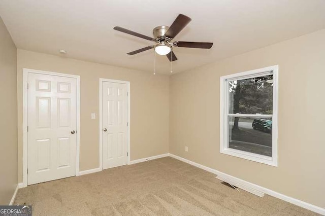 434 Mona Pl, Dallas, GA 30132 - unfurnished bedroom with baseboards, carpet flooring, and ceiling fan