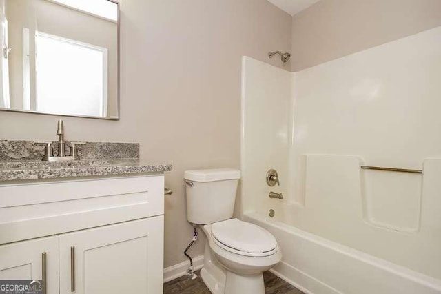 434 Mona Pl, Dallas, GA 30132 - bathroom with toilet, vanity, baseboards, and shower / bathtub combination