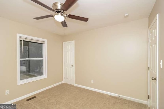 434 Mona Pl, Dallas, GA 30132 - empty room featuring light carpet, baseboards, and a ceiling fan