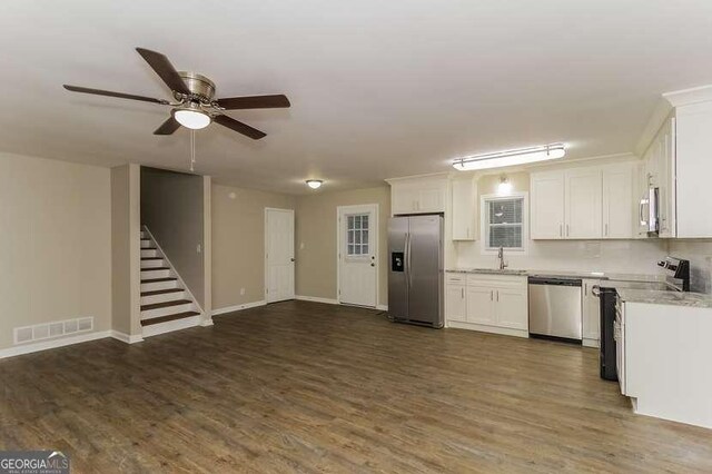 434 Mona Pl, Dallas, GA 30132 - kitchen with stainless steel appliances, a sink, white cabinetry, dark wood-style flooring, and ceiling fan