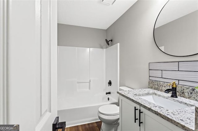 86 Williams Rd, Dallas, GA 30132 - full bathroom with toilet, vanity, wood finished floors, and shower / bath combination