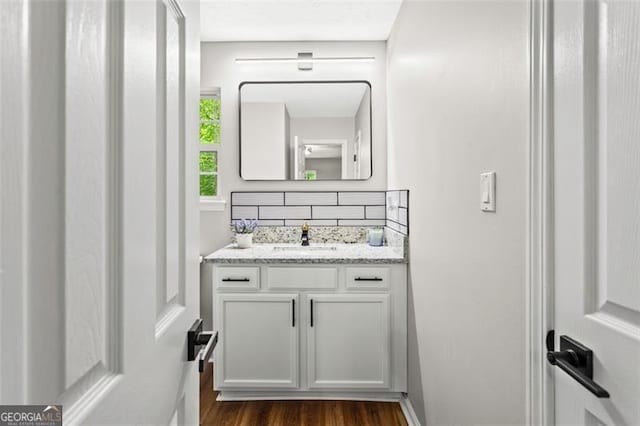 86 Williams Rd, Dallas, GA 30132 - bathroom with decorative backsplash, wood finished floors, and vanity