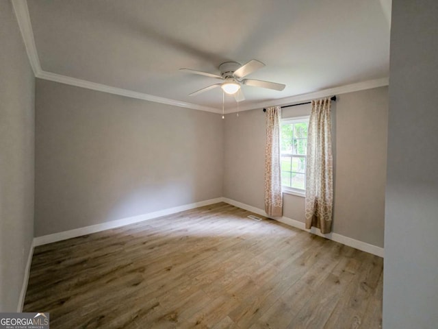 136 Oak St Unit 0, Omega, GA 31775 - spare room featuring ornamental molding, ceiling fan, wood finished floors, and baseboards