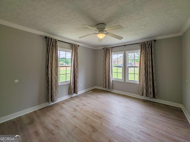 136 Oak St Unit 0, Omega, GA 31775 - spare room with a ceiling fan, wood finished floors, ornamental molding, and baseboards