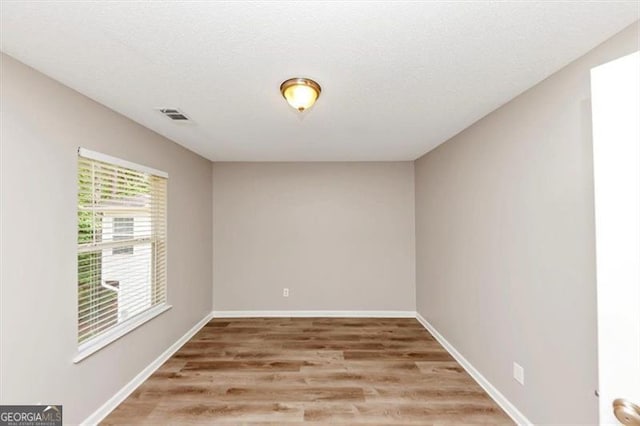 1023 Saint Augustine Pkwy, Locust Grove, GA 30248 - empty room featuring light wood finished floors and baseboards