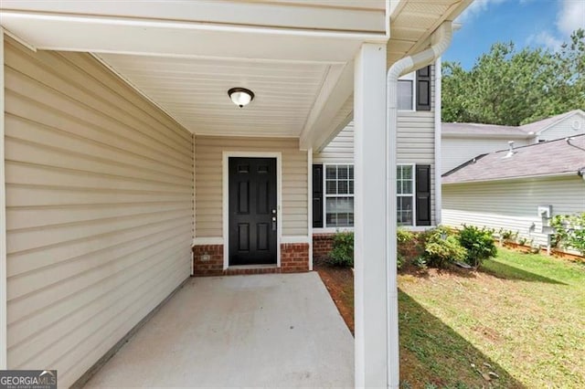 1023 Saint Augustine Pkwy, Locust Grove, GA 30248 - doorway to property featuring a yard and brick siding