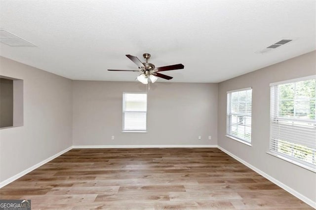 1023 Saint Augustine Pkwy, Locust Grove, GA 30248 - unfurnished room with light wood-style floors, baseboards, and ceiling fan
