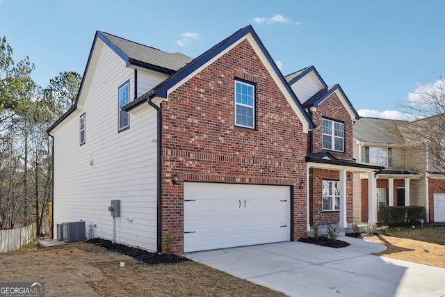 7902 W Shore Cir, Riverdale, GA 30296 - view of property exterior with central AC, an attached garage, and brick siding