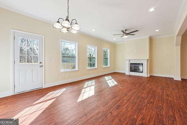 7902 W Shore Cir, Riverdale, GA 30296 - unfurnished living room featuring ornamental molding, a ceiling fan, dark wood-type flooring, a chandelier, and a glass covered fireplace