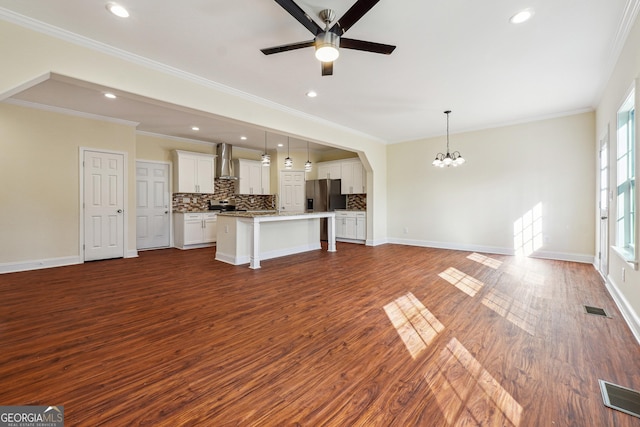 7902 W Shore Cir, Riverdale, GA 30296 - unfurnished living room featuring a chandelier, dark wood-type flooring, ceiling fan, crown molding, and recessed lighting
