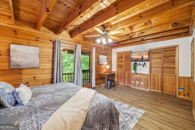 1600 My Mountain Rd, Morganton, GA 30560 - bedroom featuring access to outside, wood finished floors, beamed ceiling, wood walls, and wood ceiling