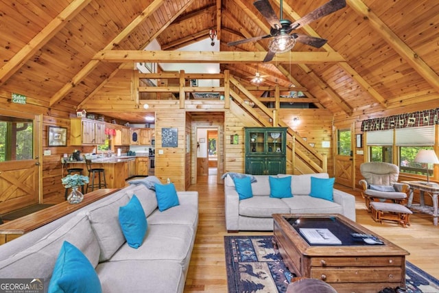 1600 My Mountain Rd, Morganton, GA 30560 - living area with wood ceiling, beamed ceiling, wood walls, healthy amount of natural light, and a ceiling fan
