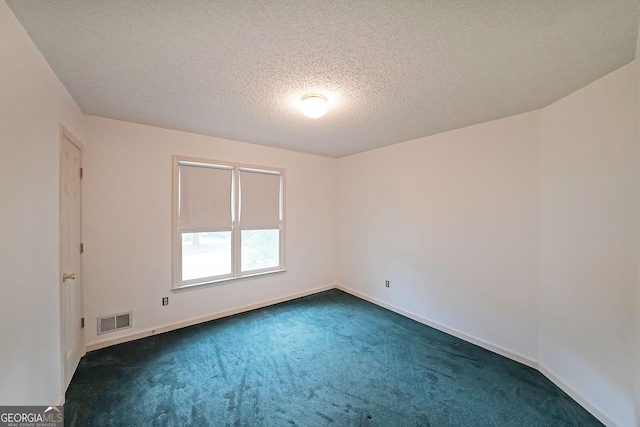 251 Lambeth Dr, Hiram, GA 30141 - spare room featuring dark carpet, baseboards, and a textured ceiling
