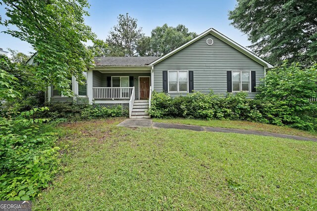 251 Lambeth Dr, Hiram, GA 30141 - ranch-style house featuring a porch and a front lawn