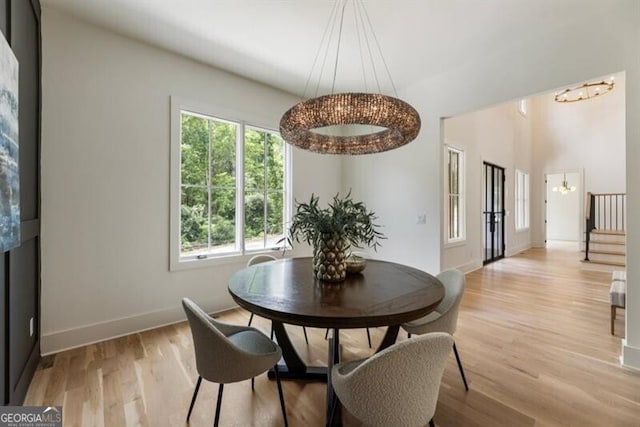 2000 Birmingham Rd, Milton, GA 30004 - dining area with a chandelier, plenty of natural light, stairs, and light wood finished floors