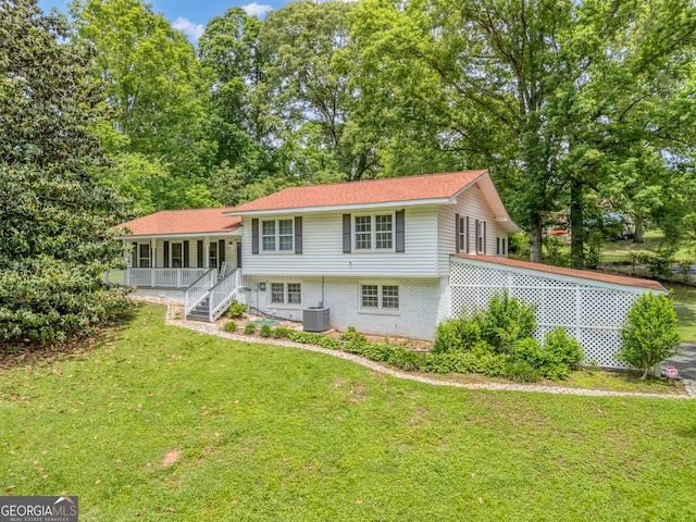 83 Summit Ridge Cir SE, Cartersville, GA 30120 - rear view of house featuring a lawn, cooling unit, a porch, and brick siding