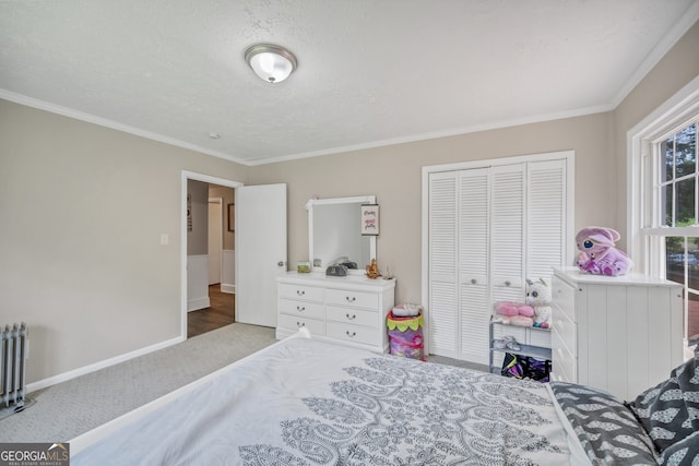 83 Summit Ridge Cir SE, Cartersville, GA 30120 - bedroom featuring crown molding, a closet, carpet floors, radiator heating unit, and baseboards