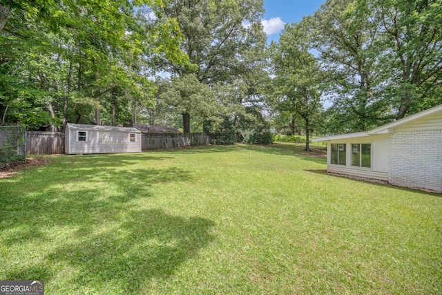 83 Summit Ridge Cir SE, Cartersville, GA 30120 - view of yard with an outbuilding, a storage shed, and view of scattered trees