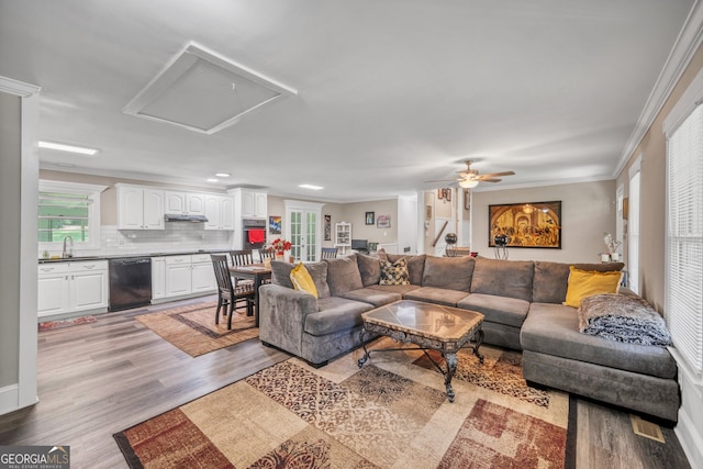 83 Summit Ridge Cir SE, Cartersville, GA 30120 - living area with light wood-style floors, crown molding, and a ceiling fan