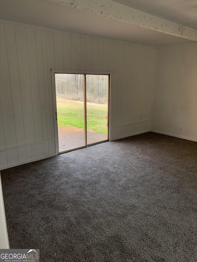 175 Thigpen Rd, Newnan, GA 30263 - unfurnished room featuring carpet, wooden walls, and baseboards