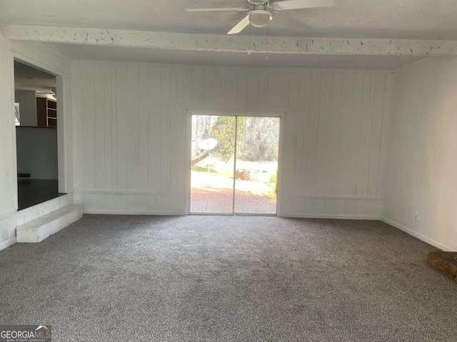 175 Thigpen Rd, Newnan, GA 30263 - unfurnished room with carpet floors, a ceiling fan, and wood walls