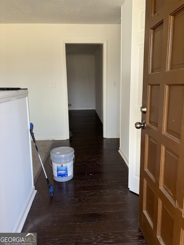 175 Thigpen Rd, Newnan, GA 30263 - hallway with dark wood-style flooring, baseboards, and a textured ceiling