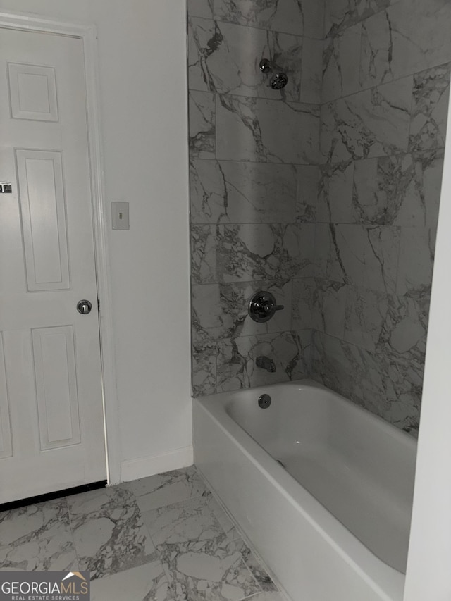 175 Thigpen Rd, Newnan, GA 30263 - bathroom featuring marble look tiles, baseboards, and shower / bathtub combination