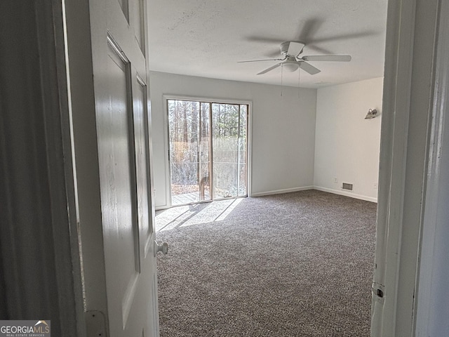 175 Thigpen Rd, Newnan, GA 30263 - spare room featuring carpet floors, a ceiling fan, and baseboards