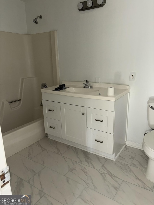 175 Thigpen Rd, Newnan, GA 30263 - full bath with marble look tiles, vanity, toilet, baseboards, and washtub / shower combination