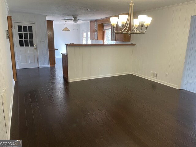 175 Thigpen Rd, Newnan, GA 30263 - spare room featuring a chandelier, dark wood-style flooring, baseboards, crown molding, and a ceiling fan