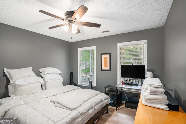 325 N Oakland Cir, Mcdonough, GA 30253 - bedroom with carpet floors, a textured ceiling, and a ceiling fan