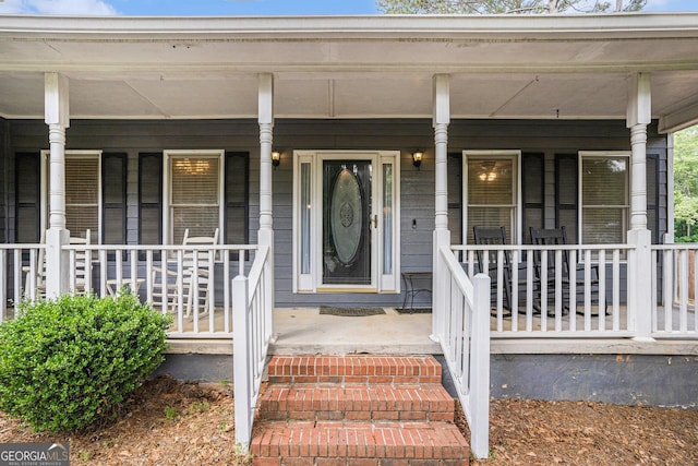 325 N Oakland Cir, Mcdonough, GA 30253 - view of exterior entry featuring a porch