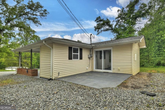 rear view of property featuring a patio