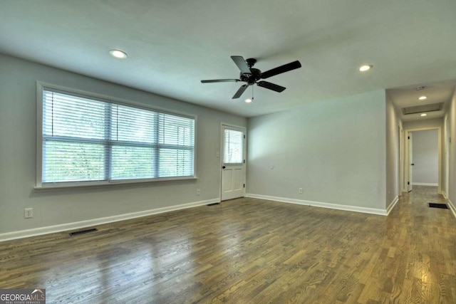 spare room with baseboards, recessed lighting, dark wood-type flooring, and a ceiling fan