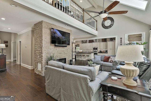 100 Rosemont, Peachtree City, GA 30269 - living area with ceiling fan, high vaulted ceiling, a stone fireplace, dark wood-style floors, and baseboards