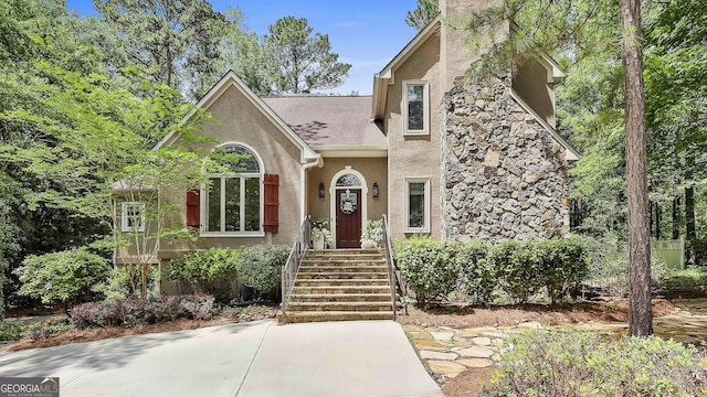 100 Rosemont, Peachtree City, GA 30269 - view of front of house with stucco siding and roof with shingles