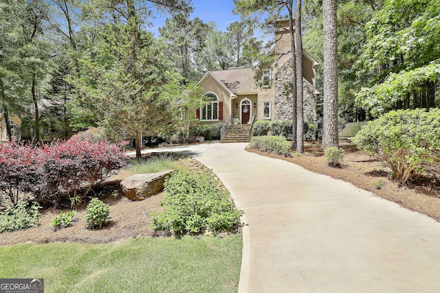 100 Rosemont, Peachtree City, GA 30269 - view of front facade with stucco siding and a chimney