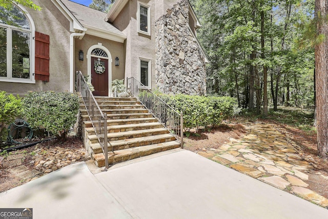 100 Rosemont, Peachtree City, GA 30269 - view of exterior entry with stucco siding and a patio