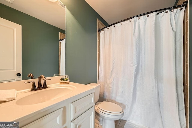 full bath featuring toilet, tile patterned flooring, vanity, and a shower with curtain